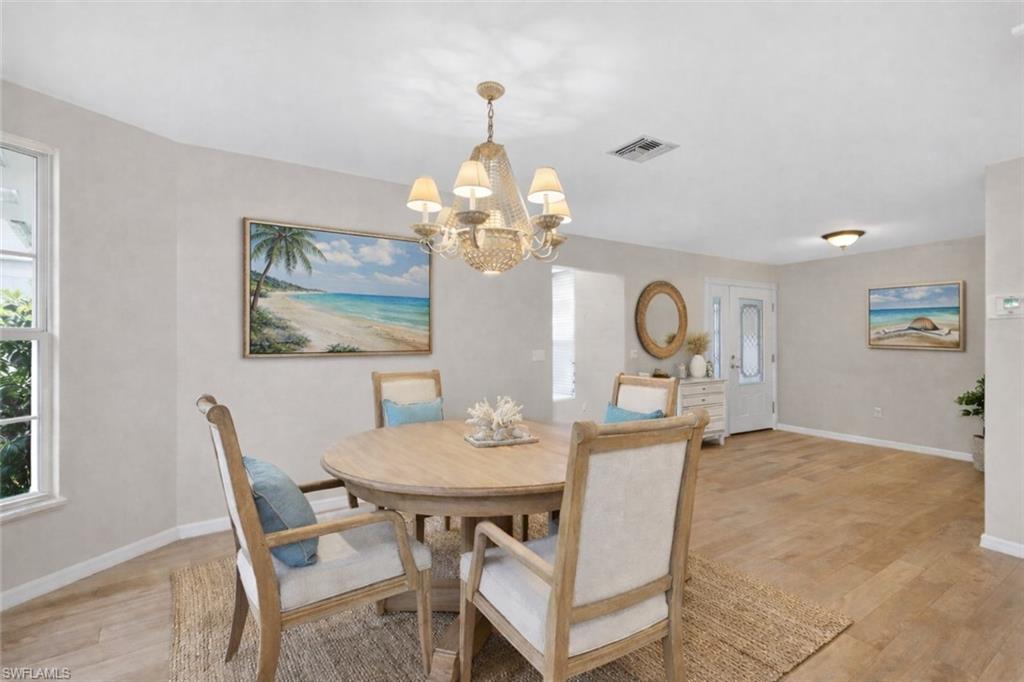8534 Chase Preserve Drive Naples, FL 34113 - Photo 7 of 44 VIRTUALLY STAGED to show Modern Coastal Dining Room