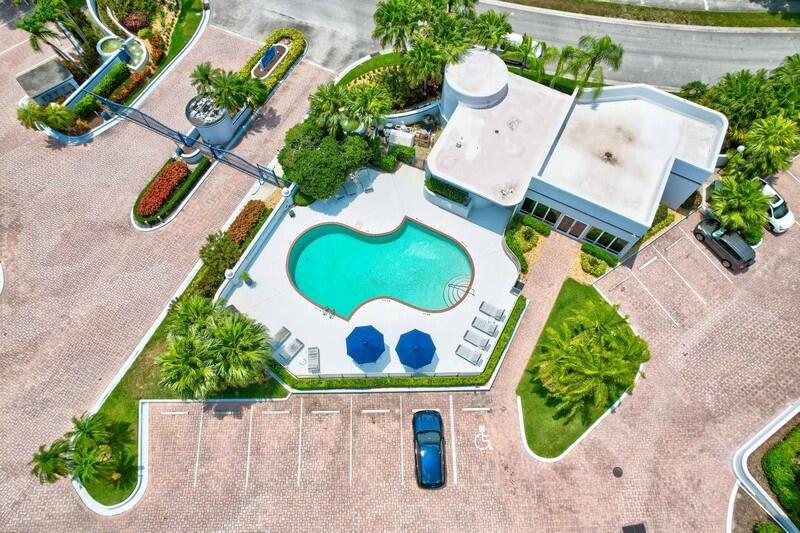 1130 Southwest Chapman Way, Unit 509 Palm City, FL 34990 - Photo 28 of 29 an aerial view of a house with a swimming pool