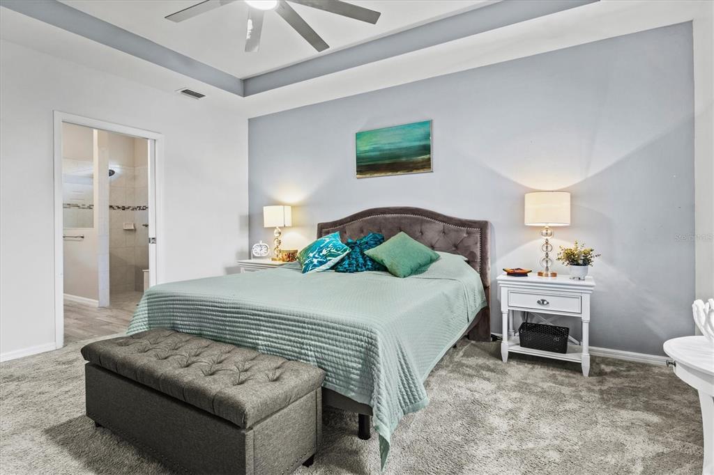 13856 RINUCCIO Street Venice, FL 34293 - Photo 22 of 63 a bedroom with a bed and a couch