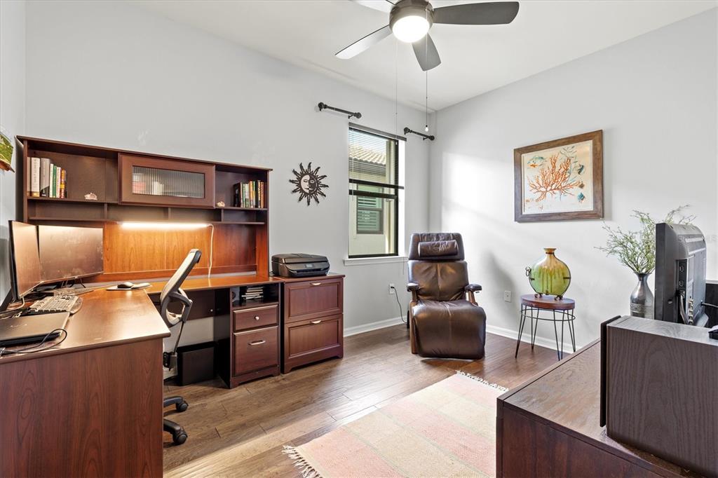 13856 RINUCCIO Street Venice, FL 34293 - Photo 31 of 63 a livingroom with workspace and a window