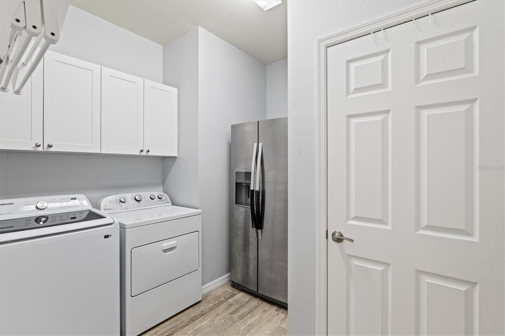 13856 RINUCCIO Street Venice, FL 34293 - Photo 32 of 63 a view of storage utility room with washer and dryer