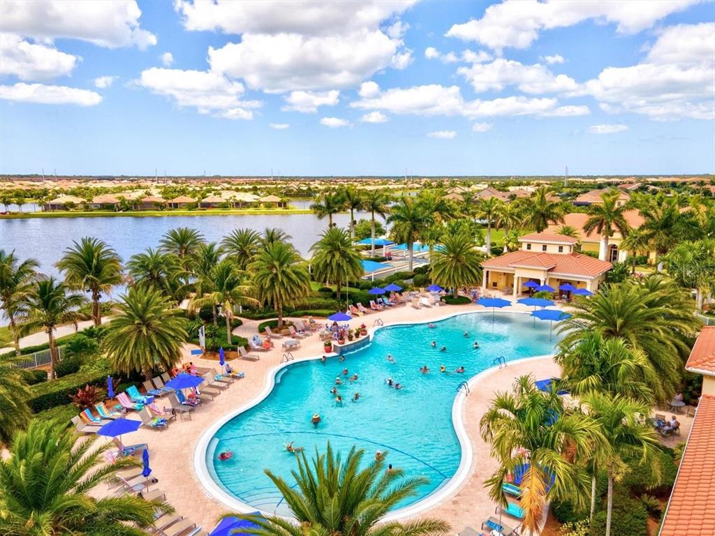 13856 RINUCCIO Street Venice, FL 34293 - Photo 46 of 63 a view of a swimming pool of an outdoor space and ocean view