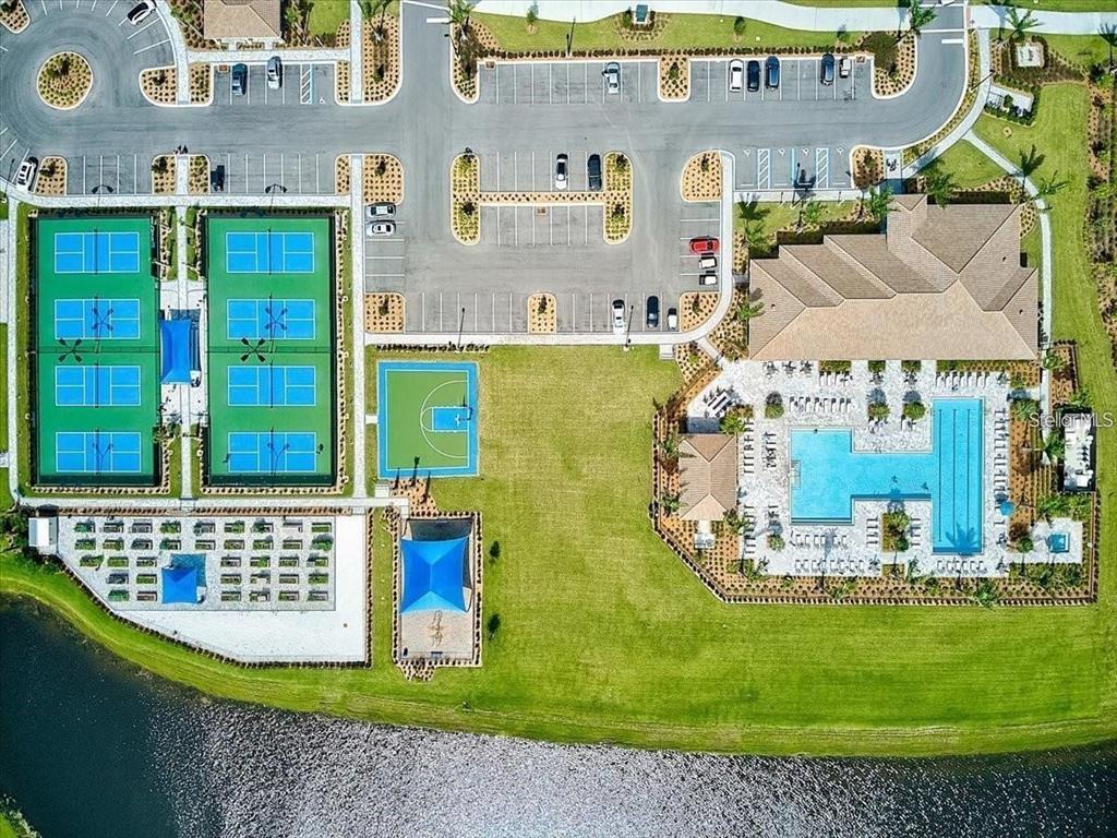 13856 RINUCCIO Street Venice, FL 34293 - Photo 48 of 63 an aerial view of a house with a swimming pool