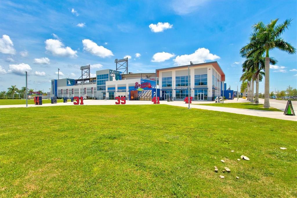 13856 RINUCCIO Street Venice, FL 34293 - Photo 61 of 63 a view of a building with a big yard and fountain