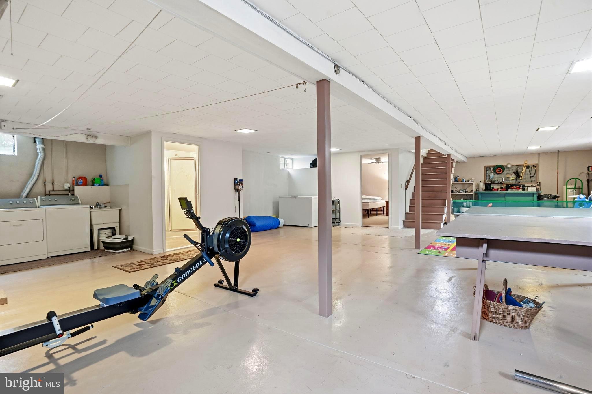 116 Green Street Green Lane, PA 18054 - Photo 18 of 38 a living room with furniture gym equipment and a table
