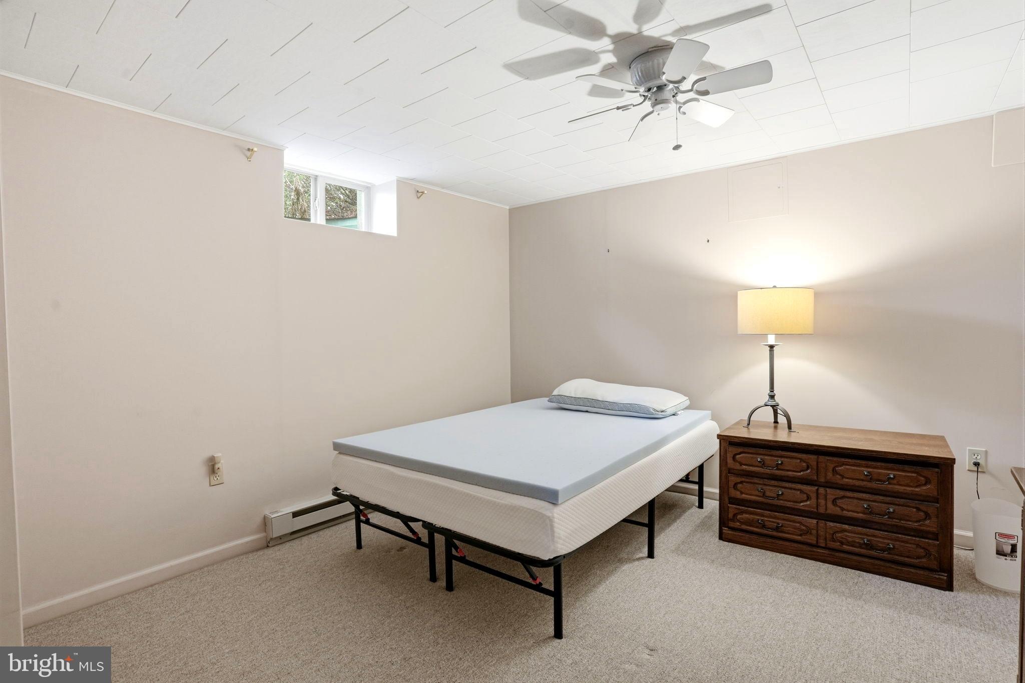 116 Green Street Green Lane, PA 18054 - Photo 20 of 38 a bedroom with a bed and a chandelier