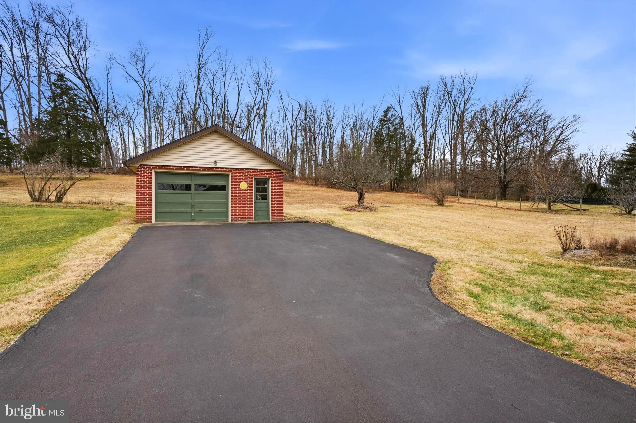 116 Green Street Green Lane, PA 18054 - Photo 2 of 38 a front view of a house with a yard and trees