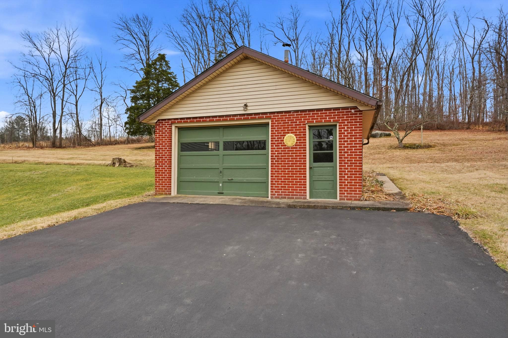 116 Green Street Green Lane, PA 18054 - Photo 27 of 38 a front view of a house with a yard and garage