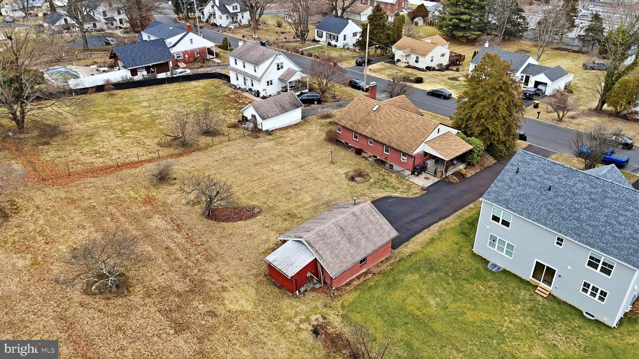 116 Green Street Green Lane, PA 18054 - Photo 36 of 38 an aerial view of a house with swimming pool and large trees