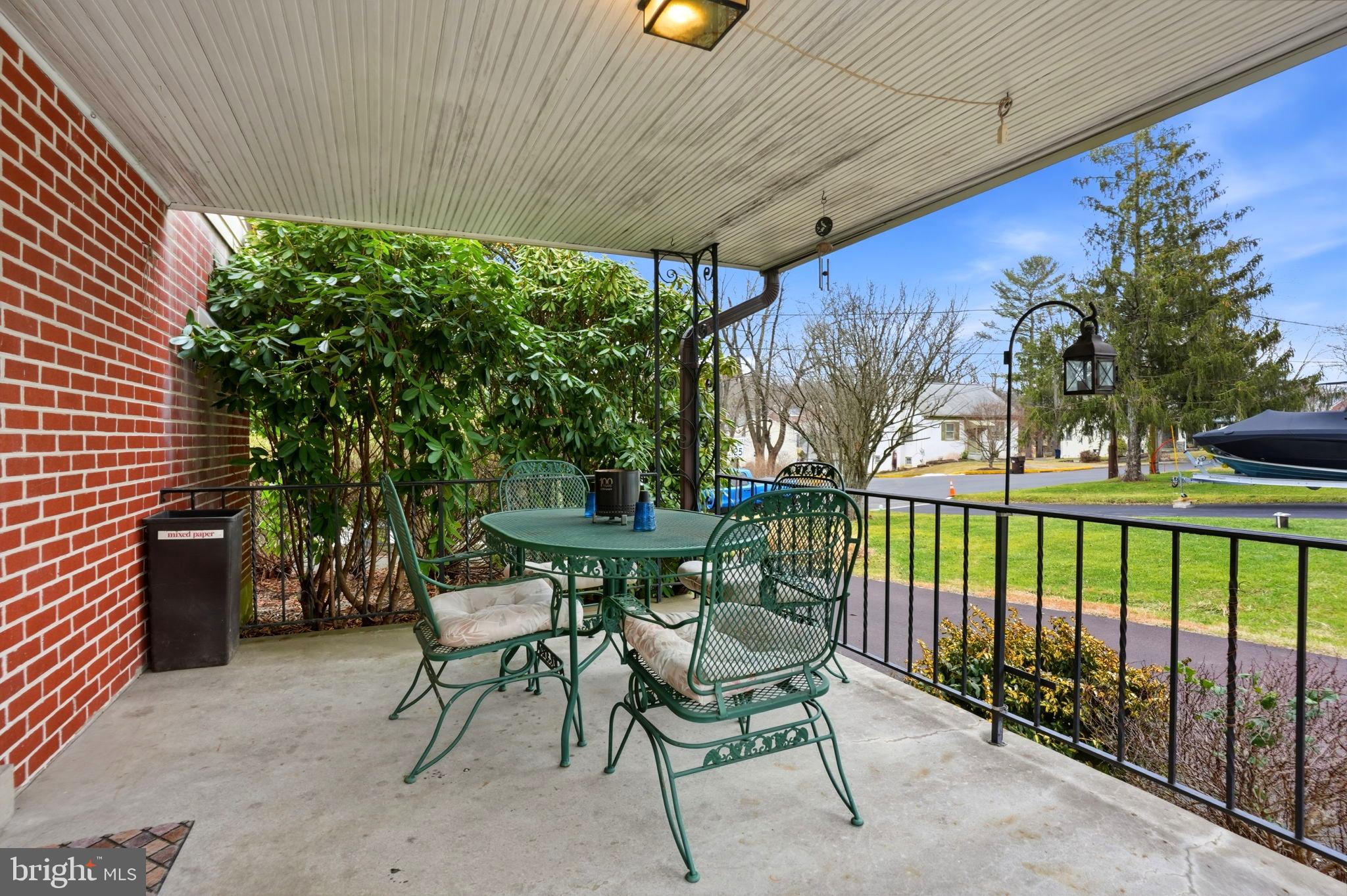116 Green Street Green Lane, PA 18054 - Photo 4 of 38 a patio with table and chairs and potted plants