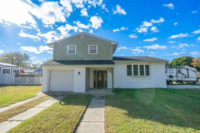 a house with a tree in front of it