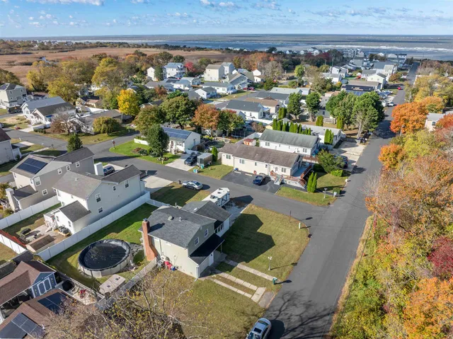 an aerial view of a house with a swimming pool