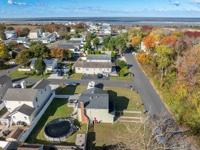 an aerial view of a house with a swimming pool