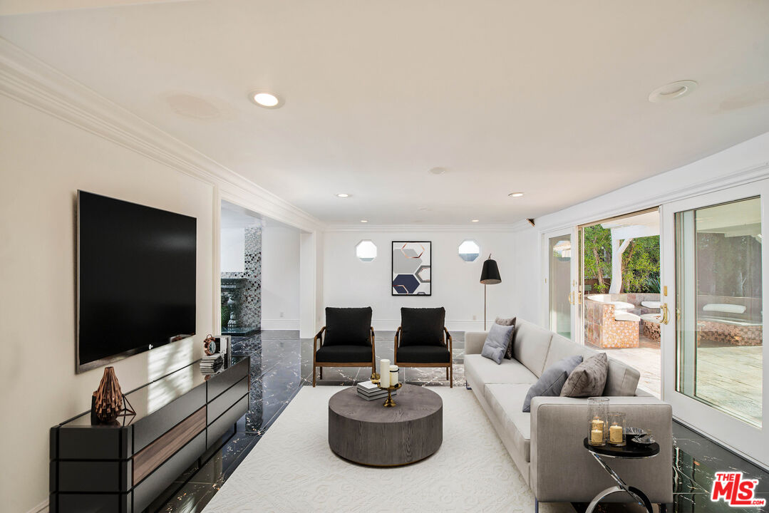 11753 Castillo Lane Porter Ranch, CA 91326 - Photo 16 of 44 a living room with furniture and a flat screen tv
