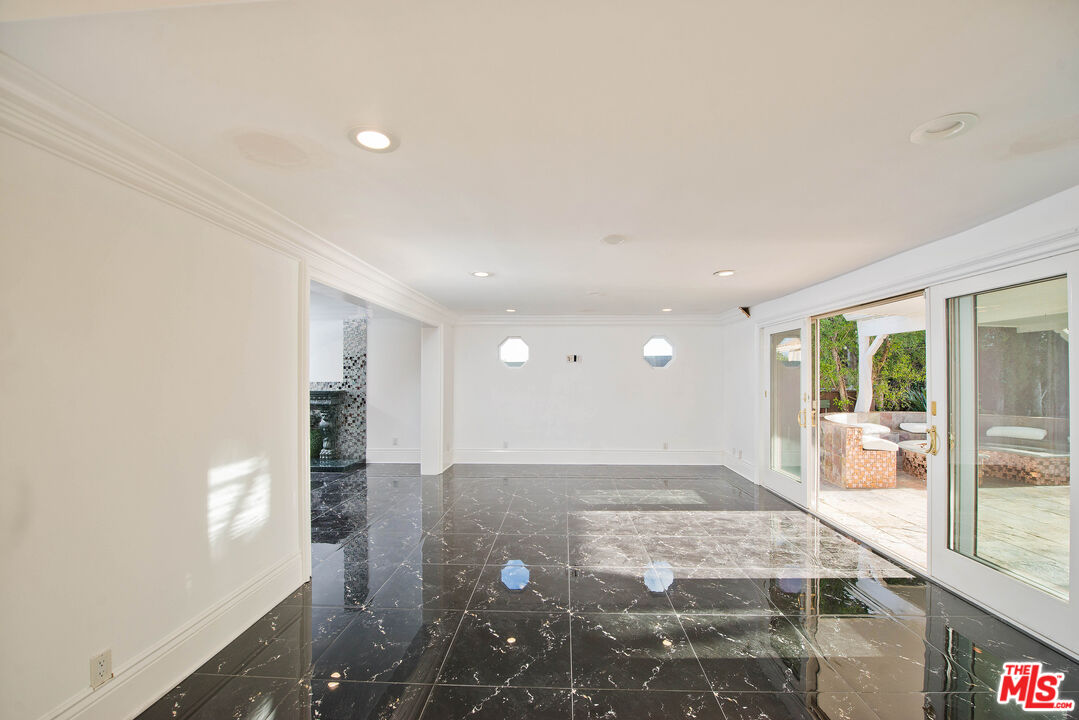 11753 Castillo Lane Porter Ranch, CA 91326 - Photo 17 of 44 a view of a big room with windows and entryway
