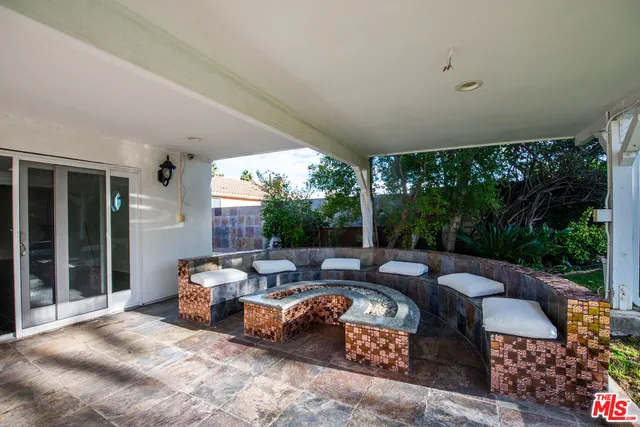 a outdoor space with patio couch and outdoor view