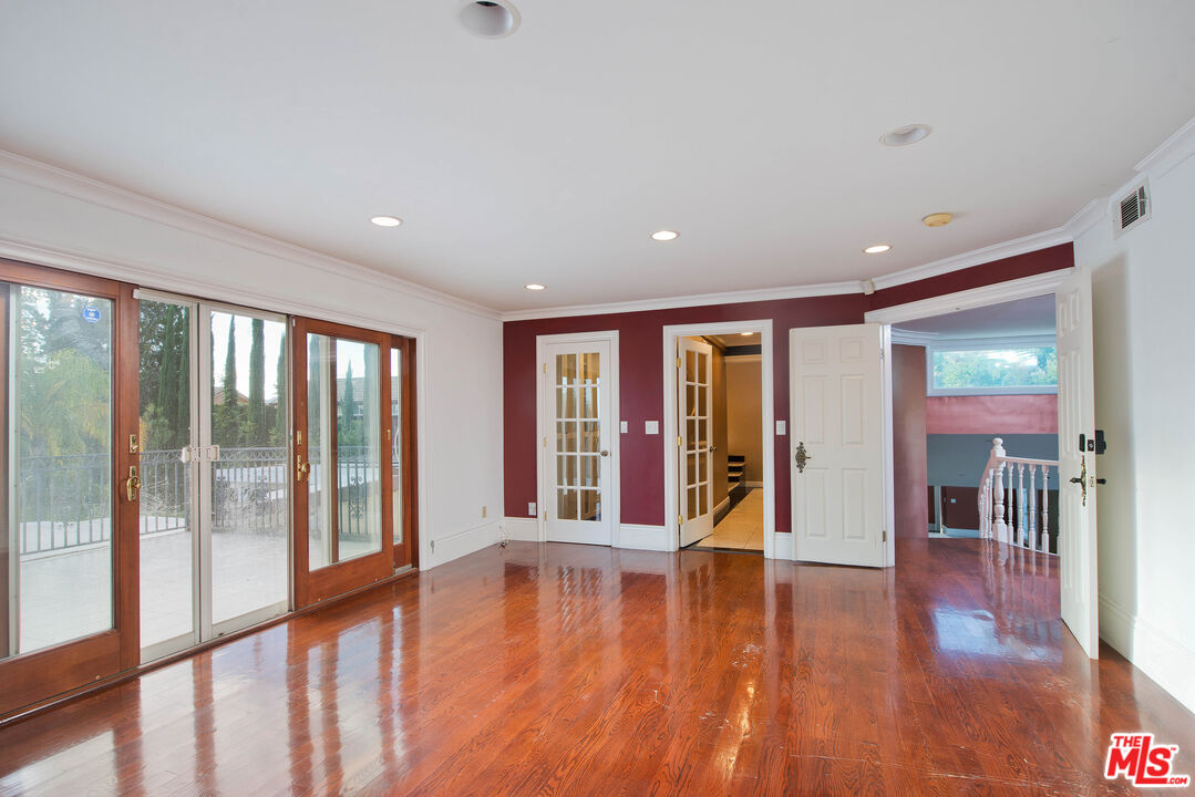 11753 Castillo Lane Porter Ranch, CA 91326 - Photo 31 of 44 a view of an entryway with wooden floor and windows