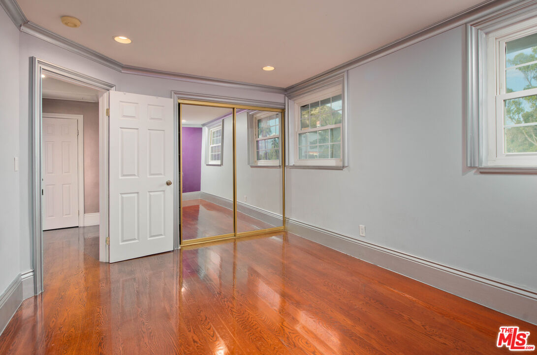 11753 Castillo Lane Porter Ranch, CA 91326 - Photo 38 of 44 wooden floor in an empty room with a window