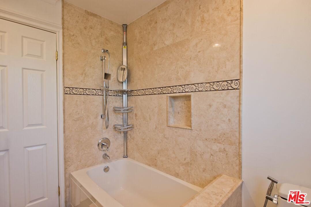 11753 Castillo Lane Porter Ranch, CA 91326 - Photo 40 of 44 a bathroom with a bathtub