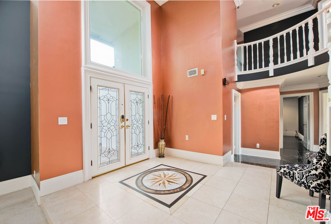 11753 Castillo Lane Porter Ranch, CA 91326 - Photo 7 of 44 a view of a hallway with residential house and entryway