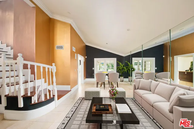 a living room with furniture and a rug