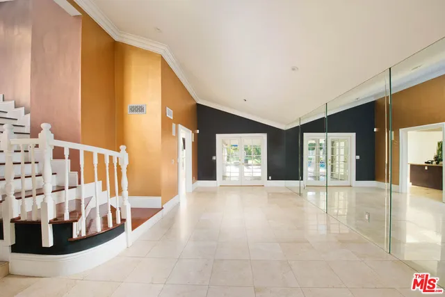 a view of an entryway with front door