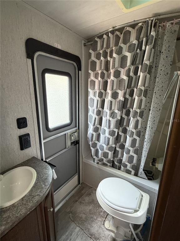 3000 Clarcona Road, Unit 743 Apopka, FL 32703 - Photo 47 of 54 a bathroom with a granite countertop toilet sink and mirror