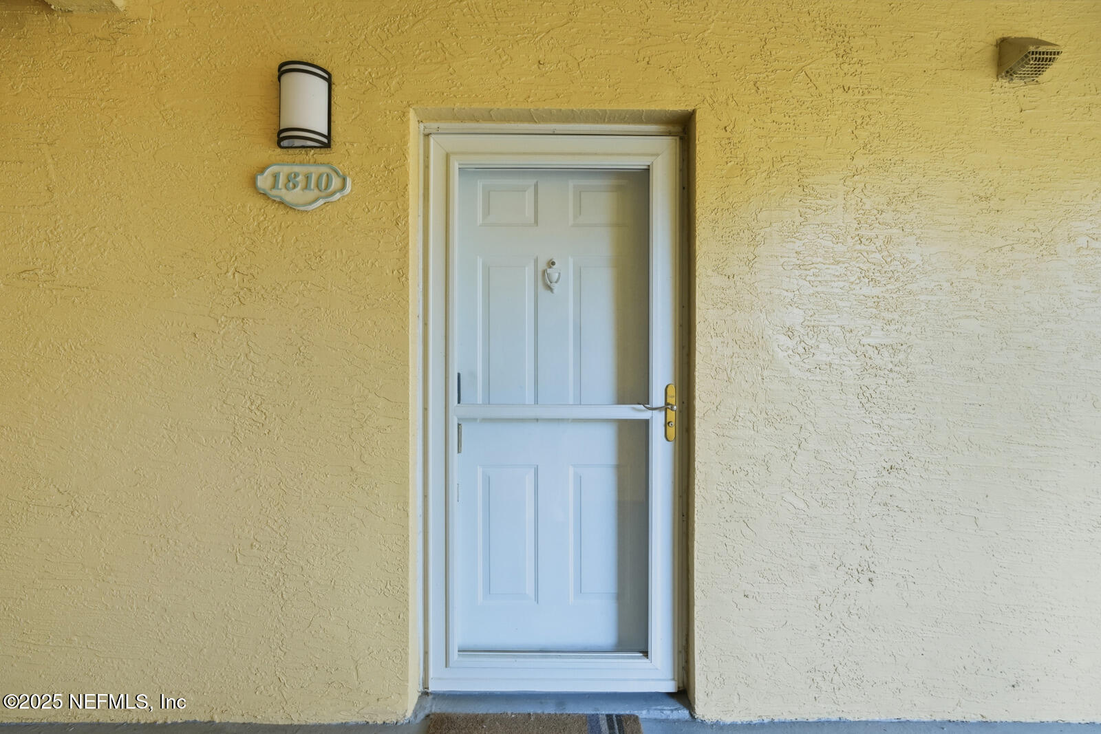 1810 Vista Cove Road St. Augustine, FL 32084 - Photo 23 of 43 a view of a hallway with wooden door