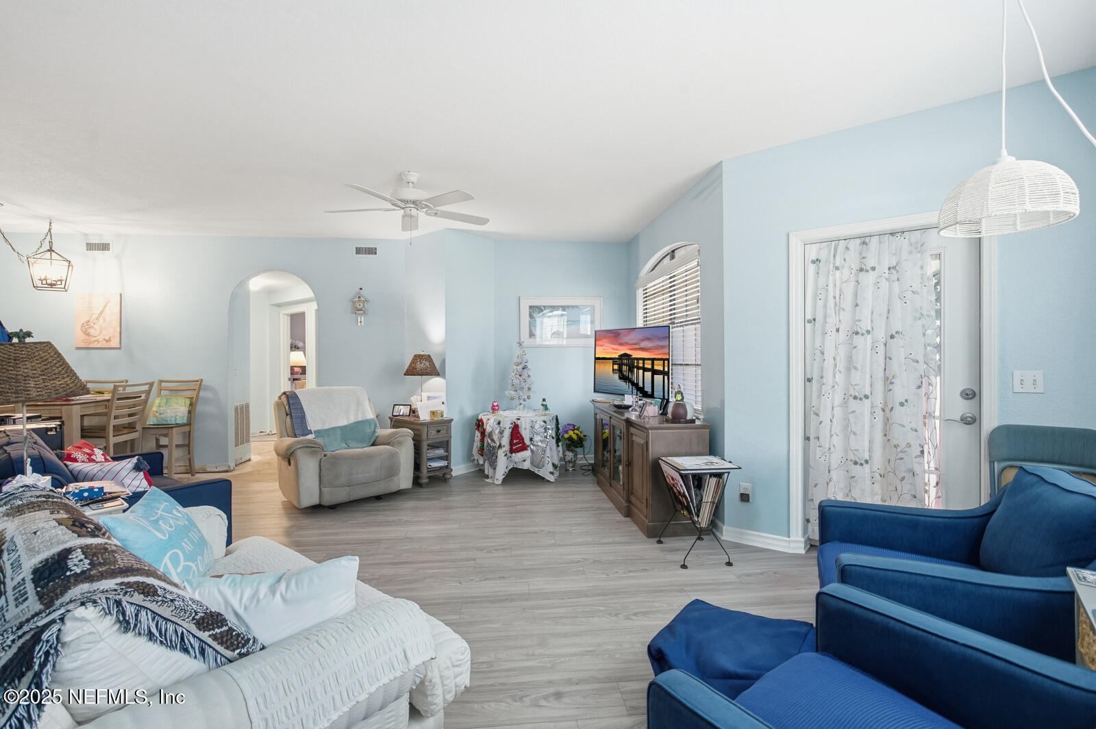 1810 Vista Cove Road St. Augustine, FL 32084 - Photo 32 of 43 a living room with furniture or couch and a flat screen tv