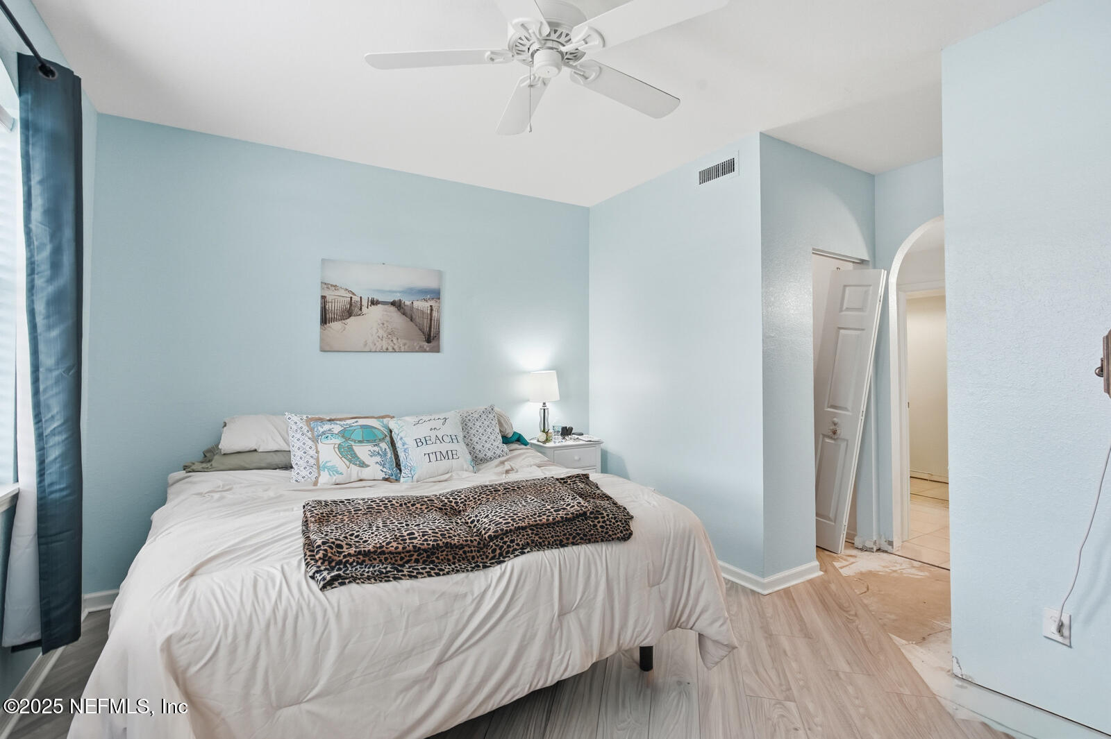 1810 Vista Cove Road St. Augustine, FL 32084 - Photo 33 of 43 a bedroom with a large bed and a chandelier