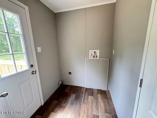 a view of an empty room and wooden floor
