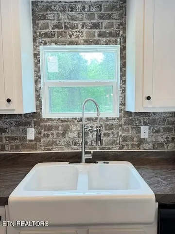 a bathroom with a sink and mirror