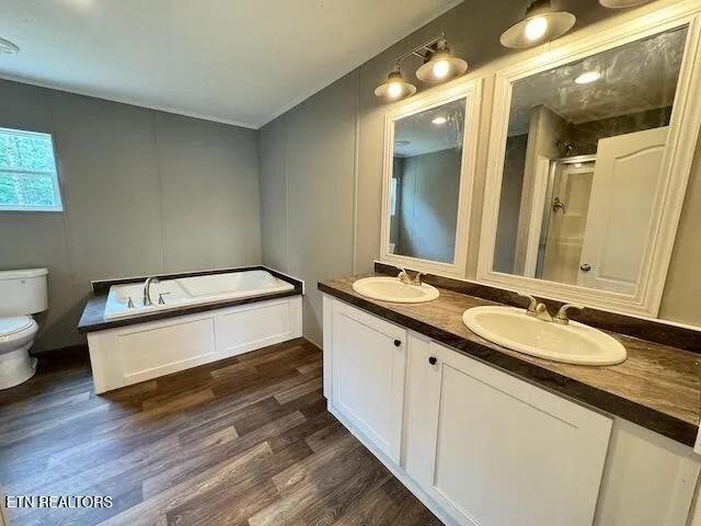 a spacious bathroom with a double vanity sink and a mirror
