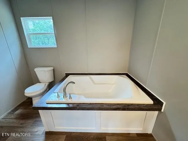 a view of staircase with rug