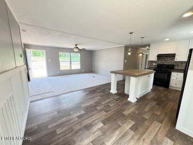 a view of kitchen with sink and wooden floor