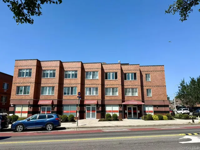 a front view of a building with garden