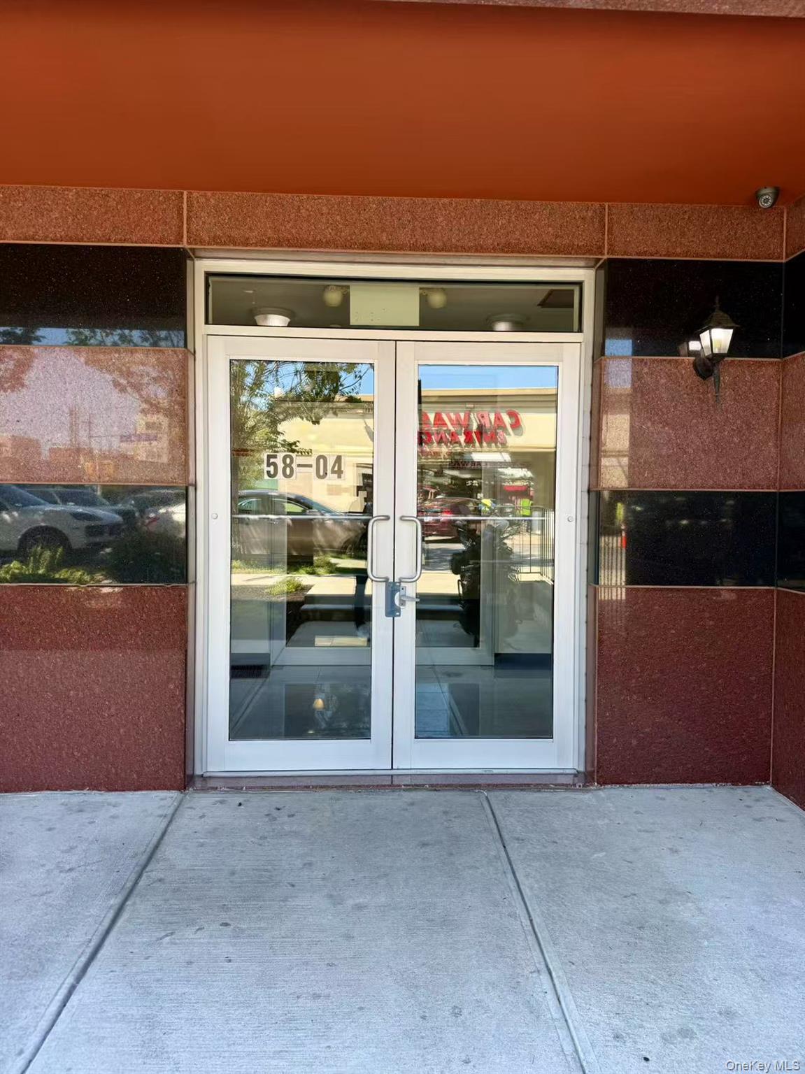 58-04 Main Street, Unit 2D Queens, NY 11355 - Photo 9 of 9 a view of a glass door of the house