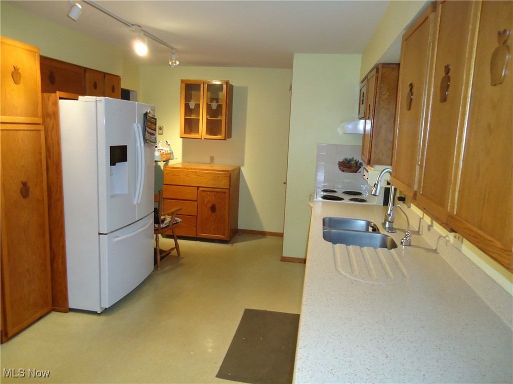 539 East Nimisila Road Uniontown, OH 44685 - Photo 9 of 41 Kitchen with white fridge with ice dispenser and sink