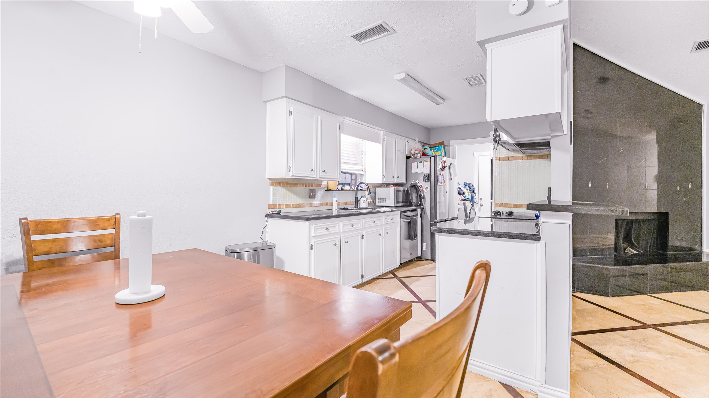 23010 Grand Rapids Lane Spring, TX 77373 - Photo 3 of 9 a kitchen with a sink cabinets and window