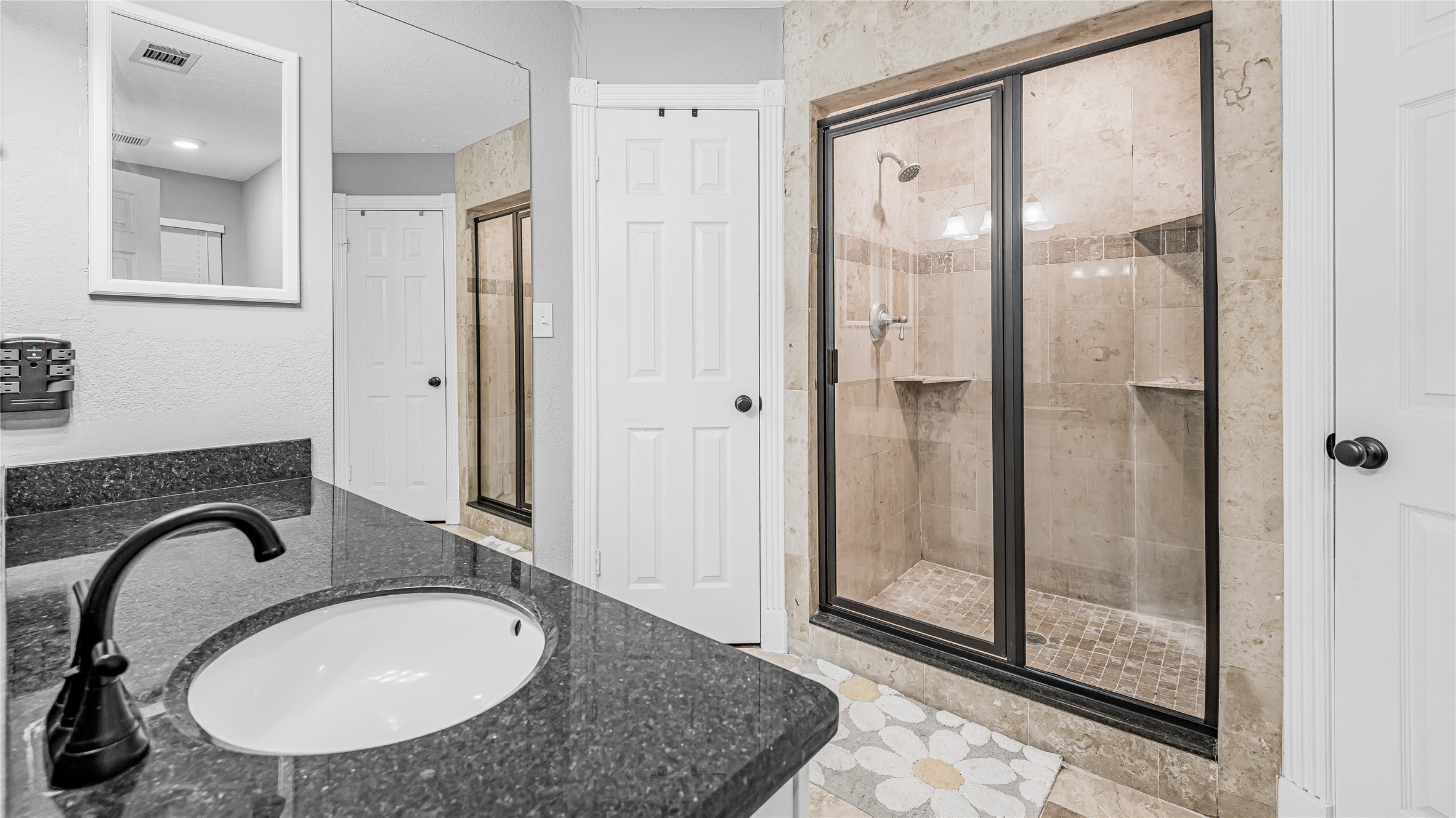 23010 Grand Rapids Lane Spring, TX 77373 - Photo 7 of 9 a bathroom with a sink and a mirror