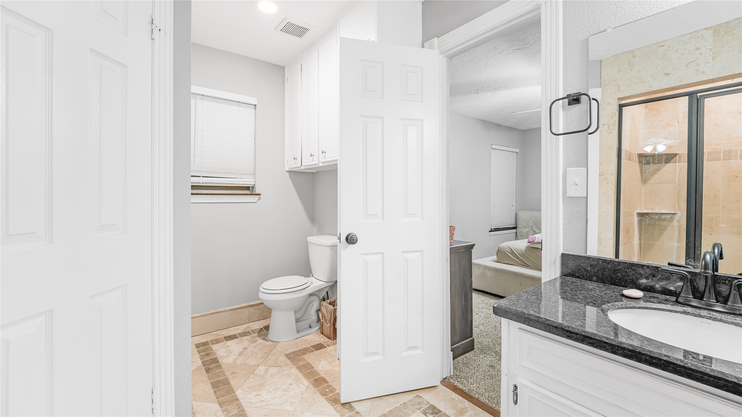 23010 Grand Rapids Lane Spring, TX 77373 - Photo 8 of 9 a bathroom with a granite countertop sink toilet and shower