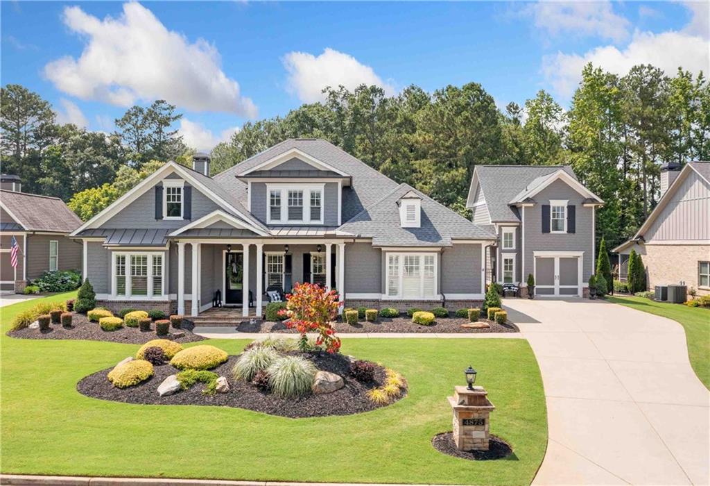 a front view of a house with a yard table and chairs