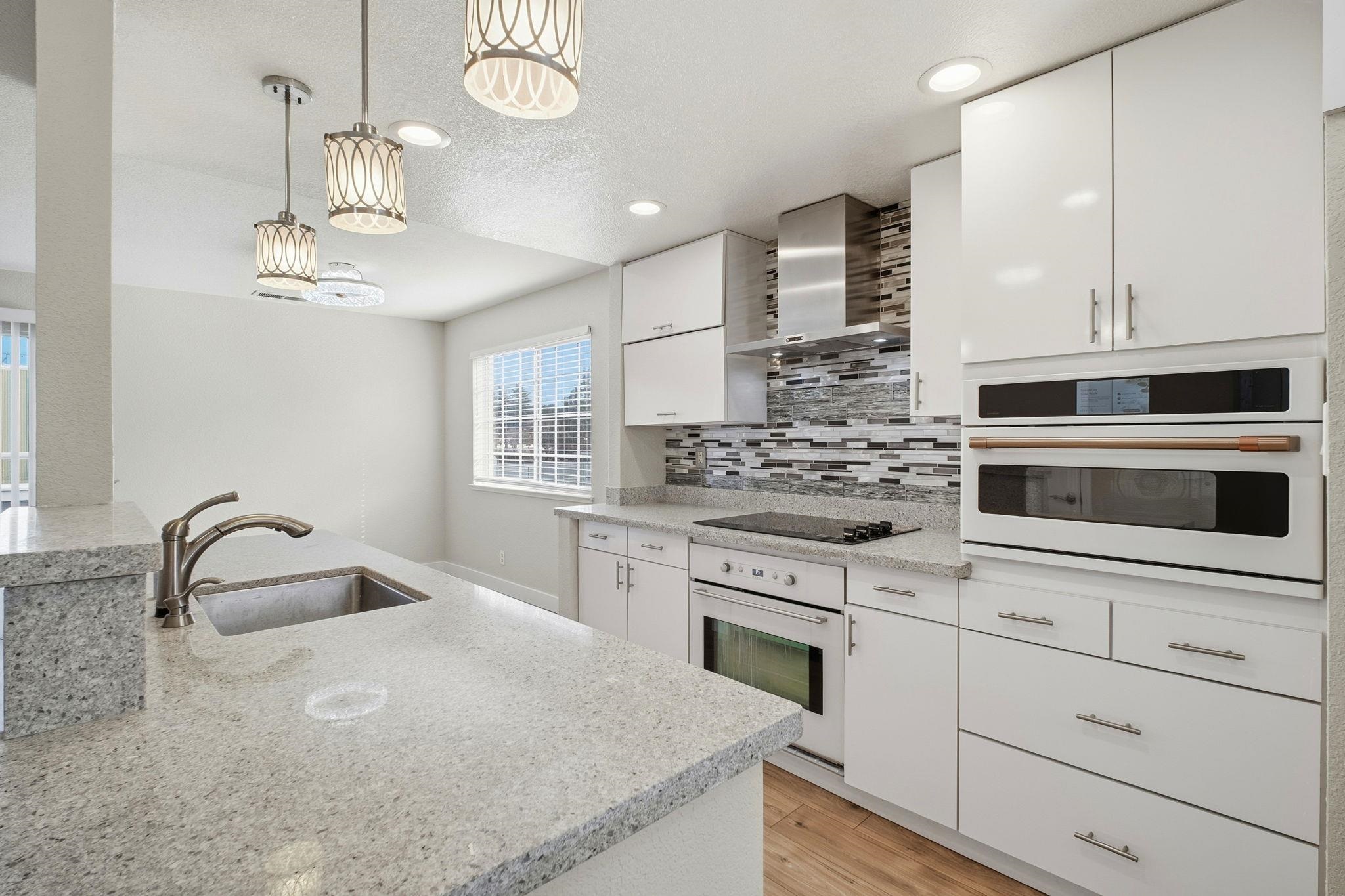 58 Trestle Drive Hayward, CA 94544 - Photo 12 of 36 a kitchen with stainless steel appliances granite countertop a sink and cabinets