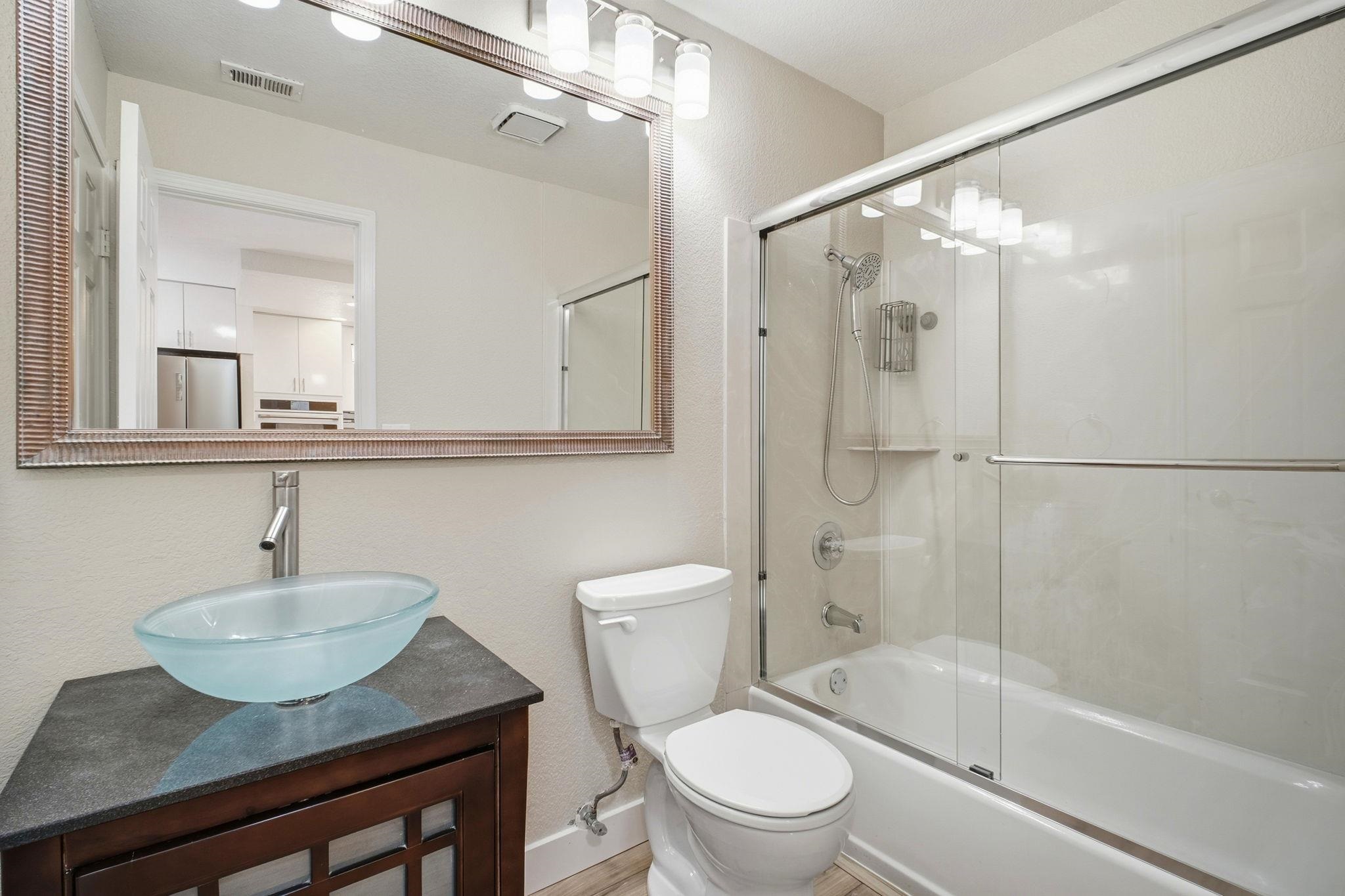 58 Trestle Drive Hayward, CA 94544 - Photo 21 of 36 a bathroom with a sink toilet and shower