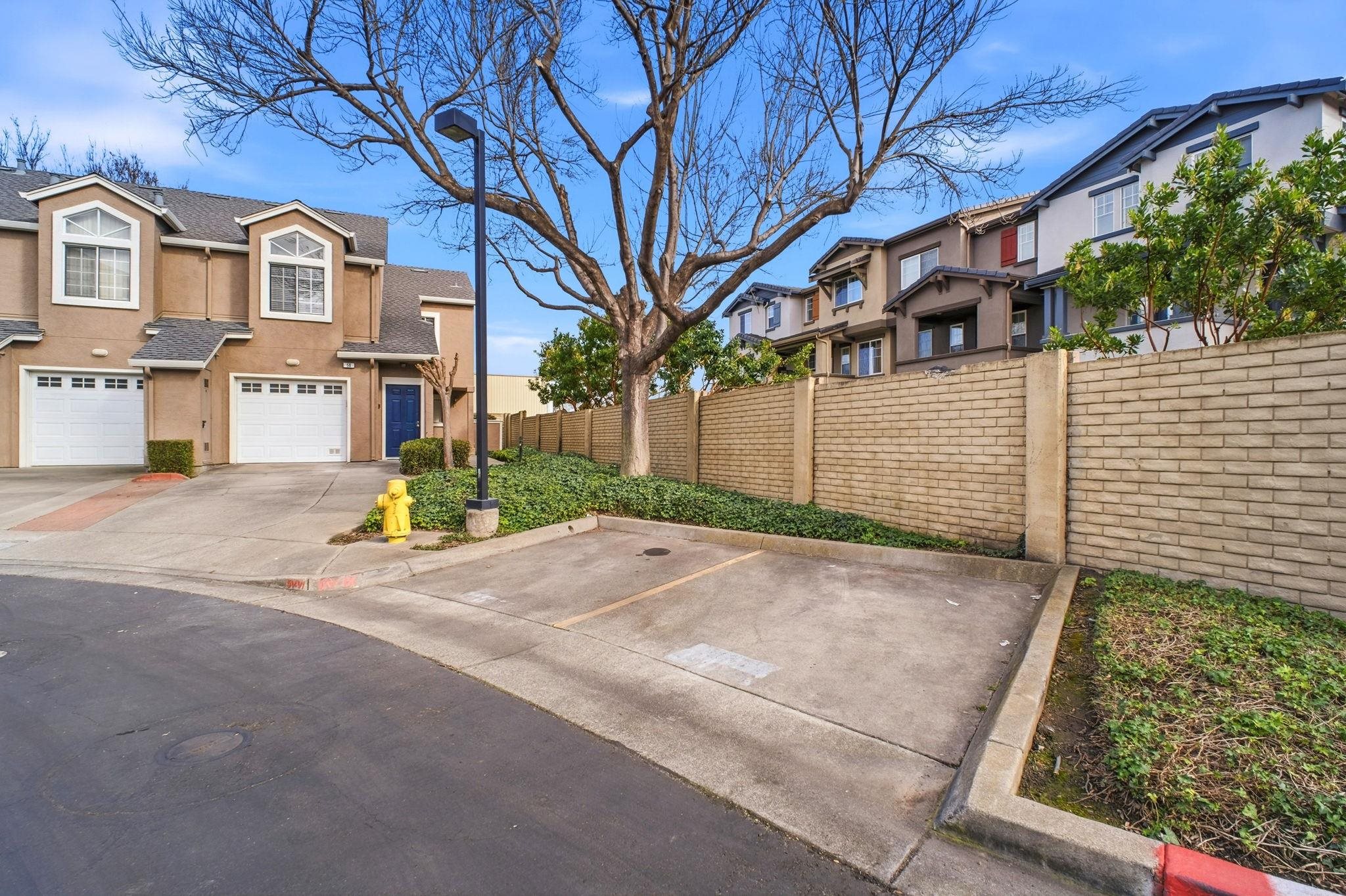 58 Trestle Drive Hayward, CA 94544 - Photo 36 of 36 a view of a white house with a large tree