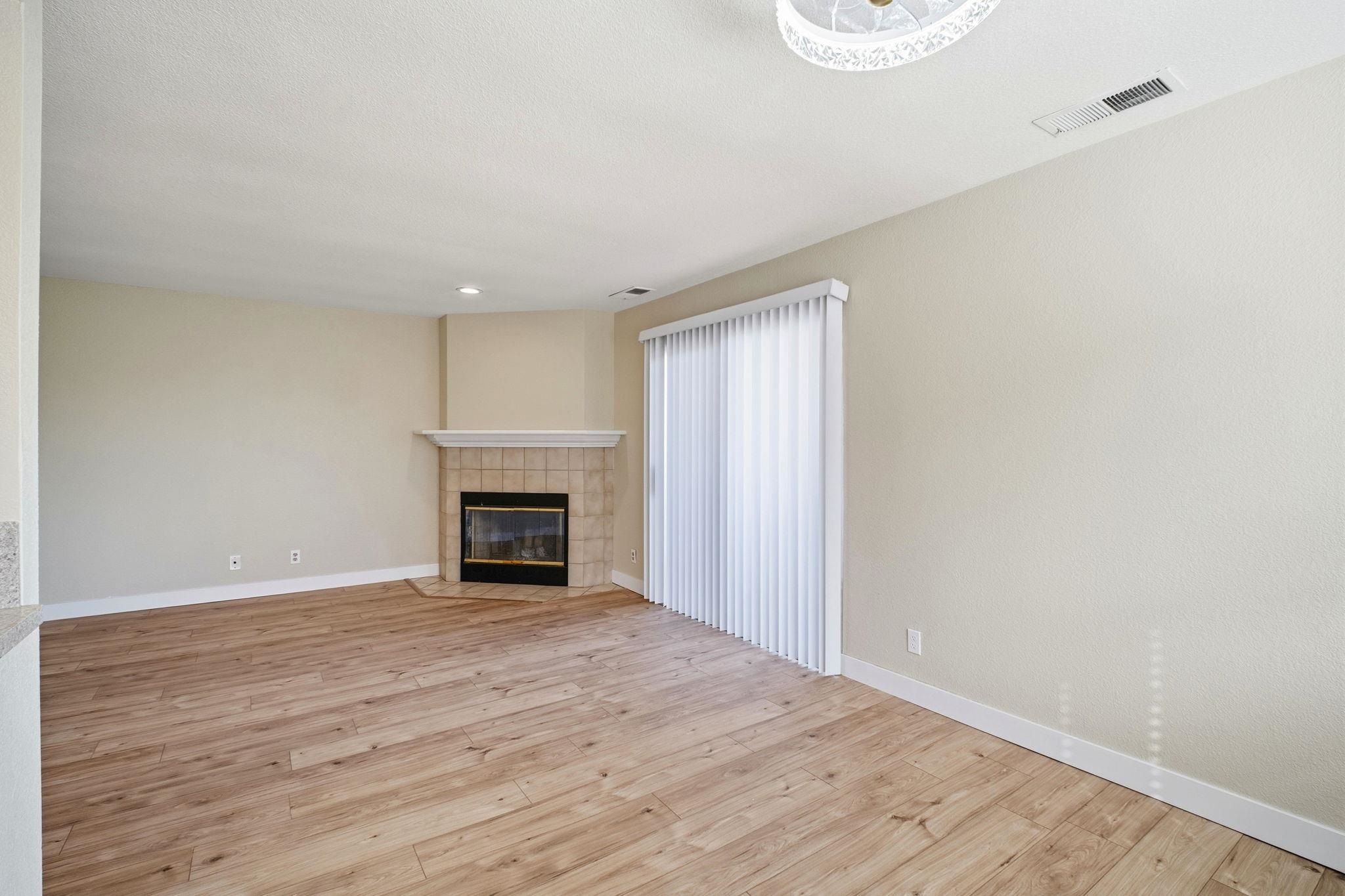 58 Trestle Drive Hayward, CA 94544 - Photo 5 of 36 a view of an empty room with wooden floor and a window