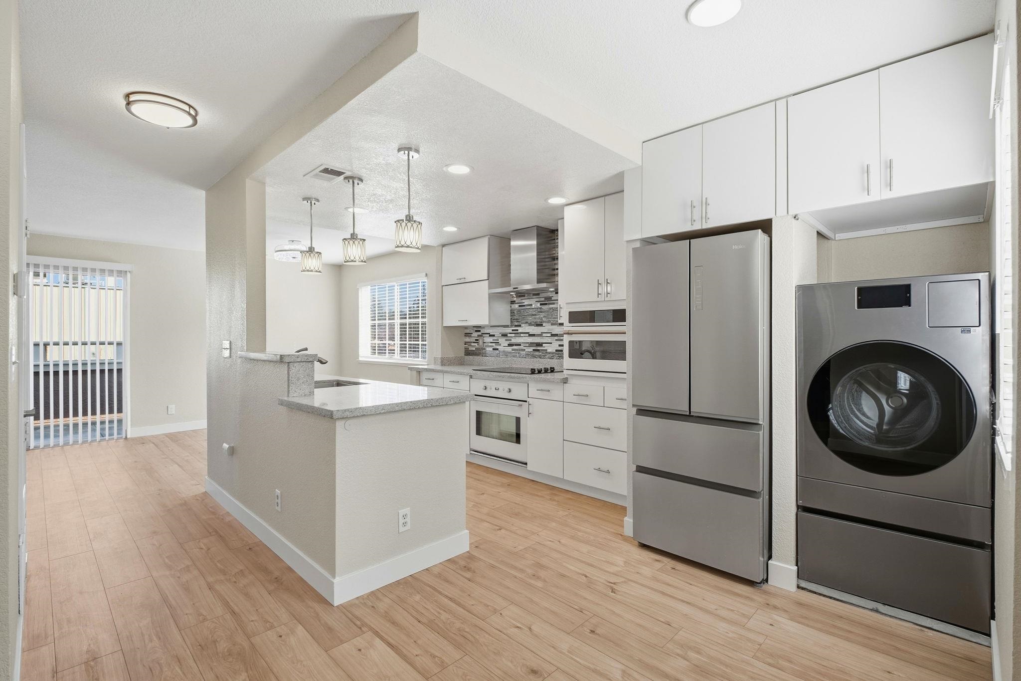 58 Trestle Drive Hayward, CA 94544 - Photo 10 of 36 a kitchen with stainless steel appliances a stove a refrigerator and cabinets