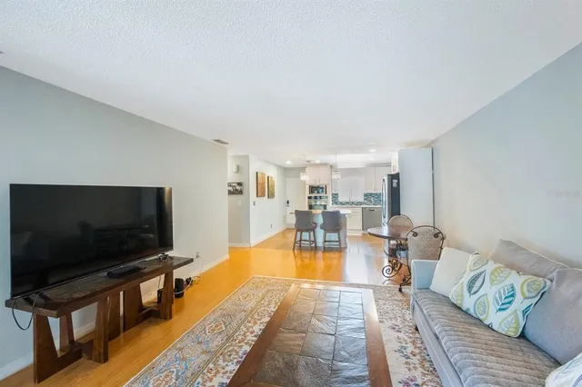 a bedroom with a bed and glass table