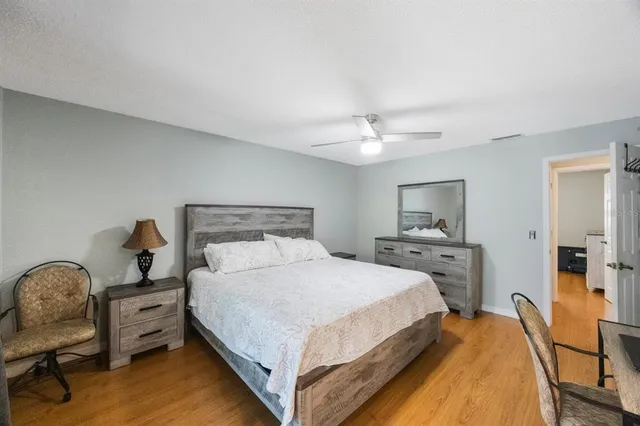 a bedroom with a bed and a table in it