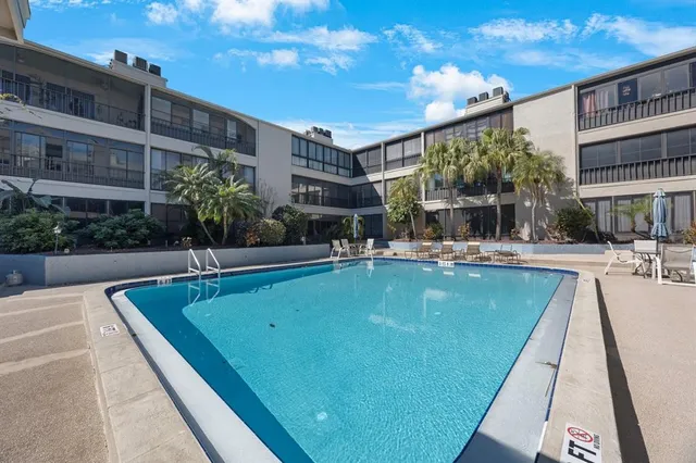 a view of a dining room with furniture and a large window